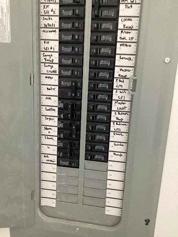 Responded to callback for water heater continuing to trip circuit breaker. Performed electrical diagnostics using multimeter to test voltage and continuity at water heater unit and electrical connections. Measured 13.1 reading during testing process. Inspected main electrical panel and verified circuit breaker assignments, including water heater circuit identification. Service provided complimentary as follow-up to previous visit, with issue documented for further evaluation.