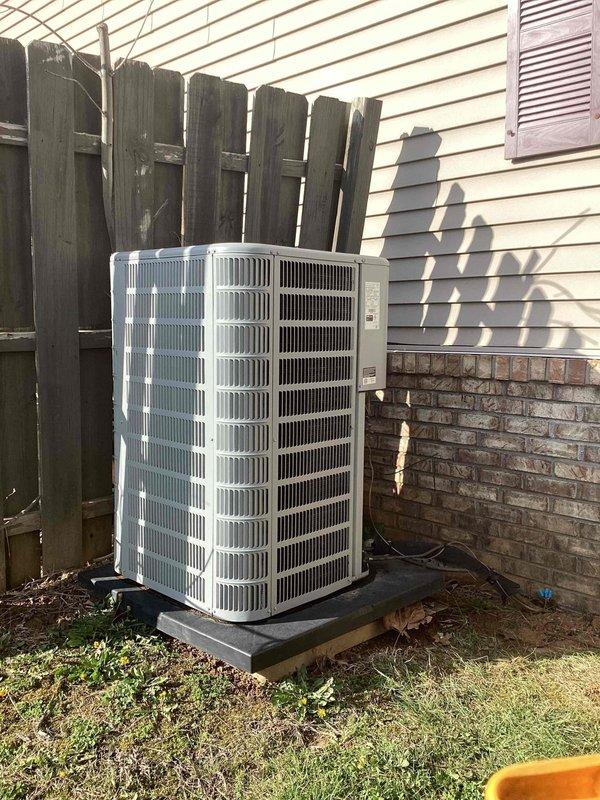 Responded to no cooling complaint on residential air conditioning system. Upon arrival, confirmed unit was running but not producing cold air. Evaluated outdoor condenser unit and indoor thermostat settings, documented system conditions with photos showing condenser positioned on exterior concrete pad and thermostat display reading 65°F. Customer requested callback with repair options and payment arrangements prior to technician departure.