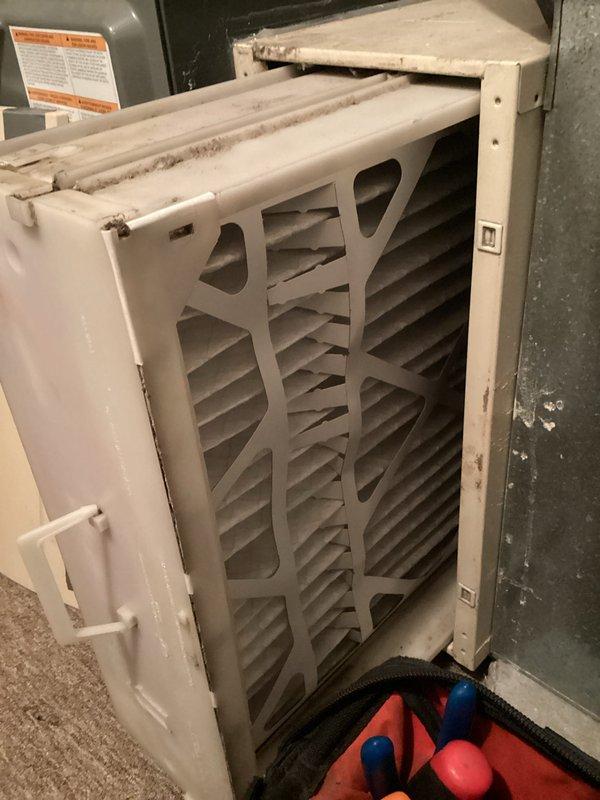 Completed monthly HVAC maintenance including CCH system inspection and filter replacement. Replaced dirty 20x25x1 pleated air filter with new filter as part of basic monthly service plan. Verified thermostat operation showing system maintaining 69°F setpoint with proper cooling mode functionality.