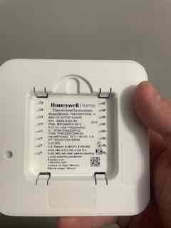 Returned to property to replace defective Honeywell Home T6 digital thermostat under warranty. Removed failed unit from wall and installed new replacement thermostat, connecting all necessary wiring and verifying proper communication with HVAC system. Confirmed unit powered on correctly, programmed settings, and tested cooling operation to ensure system responded appropriately to thermostat commands.