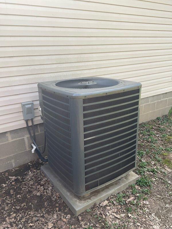 Responded to service call for 9-year-old HVAC system that experienced electrical damage from repeated power surges during utility pole replacement work. Conducted thorough inspection of outdoor condenser unit, documenting significant debris accumulation within cabinet and assessing electrical components including control board, capacitor, and wiring. Provided comprehensive replacement estimate after determining multiple components likely sustained damage from power fluctuations, recommending full system replacement versus individual component repairs given age of equipment and extent of potential electrical damage.