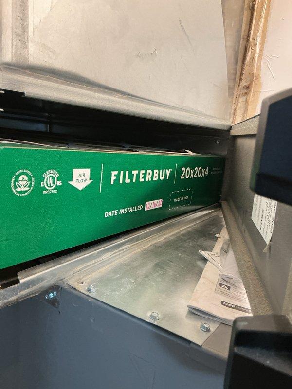 Completed comprehensive heating maintenance inspection and filter replacement. Installed new 20x20x4 FILTERBUY air filter with proper airflow direction in the HVAC system's filter housing, documenting installation date on filter. Inspected air handler unit and control system, verifying proper operation of all heating components.