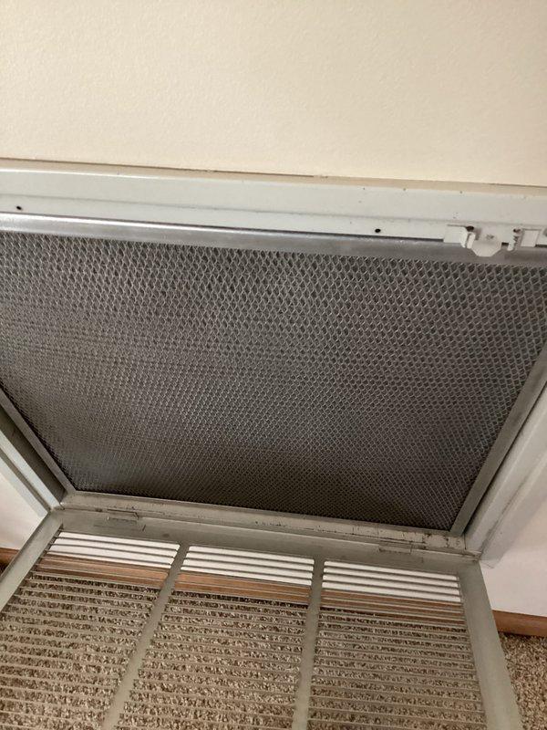 Completed heating maintenance service including system inspection and filter replacement. Removed heavily soiled return air filter showing significant dust accumulation and installed new 20x20x1 pleated media filter per customer care hours agreement. System operational and airflow restored to optimal performance.