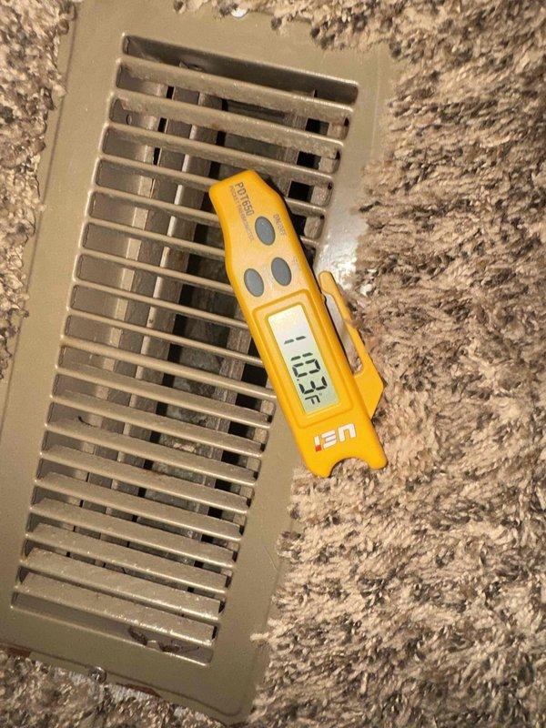 Successfully installed Lennox 80-90% AFUE gas furnace in residential utility closet with complete ductwork connections and PVC venting system. Post-installation testing confirmed proper airflow and system operation with supply register temperature reading of 43.3°F, indicating unit cycling and operational readiness.