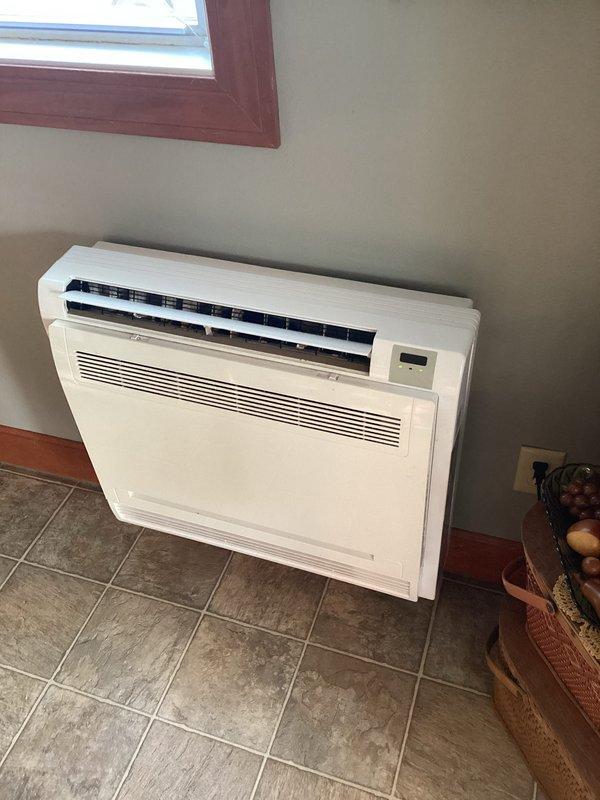 Completed basic monthly maintenance on two mini-split systems totaling six indoor air handler units. Performed filter cleaning and replacement on all six heads, verified remote control functionality with temperature settings, and confirmed proper operation of floor-mounted unit with digital controls displaying correctly.
