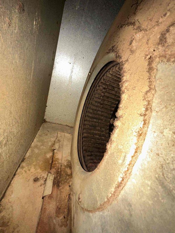 Responded to no cooling complaint on residential split system air conditioning unit. Upon arrival, confirmed indoor unit was operational but outdoor condensing unit was not running. Diagnosed failed capacitor on outdoor unit, evidenced by visible corrosion and rust on capacitor casing. Replaced defective capacitor, restored power to system, and verified proper operation of outdoor condensing unit with normal compressor and fan function.