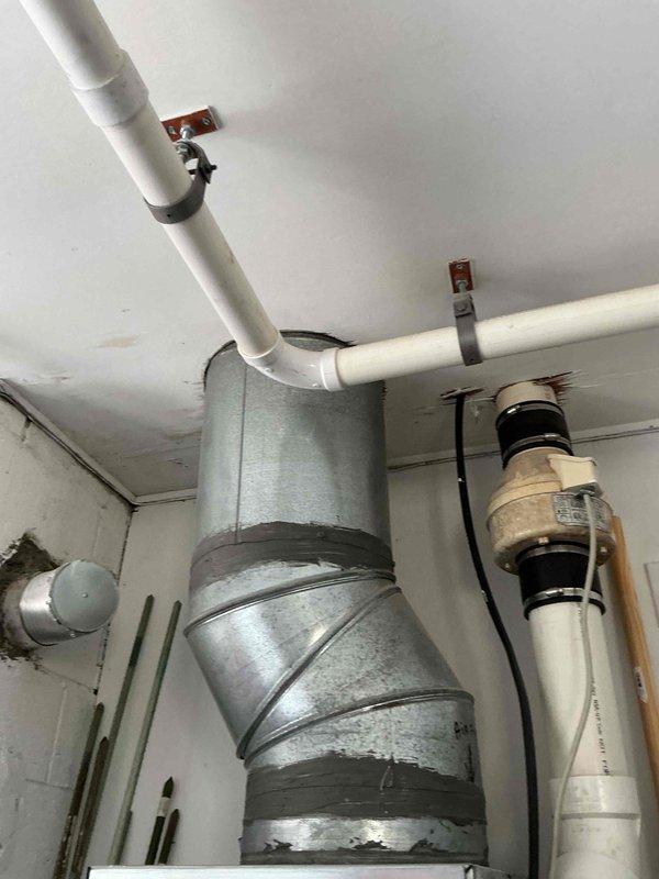 Conducted on-site evaluation for heat pump water heater installation at residential property. Assessed existing mechanical room infrastructure including HVAC ductwork, PVC piping systems, and utility space configuration to determine optimal placement and installation requirements for new heat pump water heater unit. Documented current plumbing connections, electrical access points, and clearance specifications necessary for proper equipment installation and code compliance.