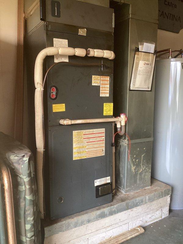 Completed comprehensive heating maintenance inspection on residential HVAC system consisting of indoor furnace unit and outdoor Amana heat pump. Identified expired 20x20x4 air filter requiring replacement, which was not included in basic maintenance service. Performed standard system checks, verified operational status of all components, and documented equipment condition with visual records of both interior furnace installation and exterior condenser unit.