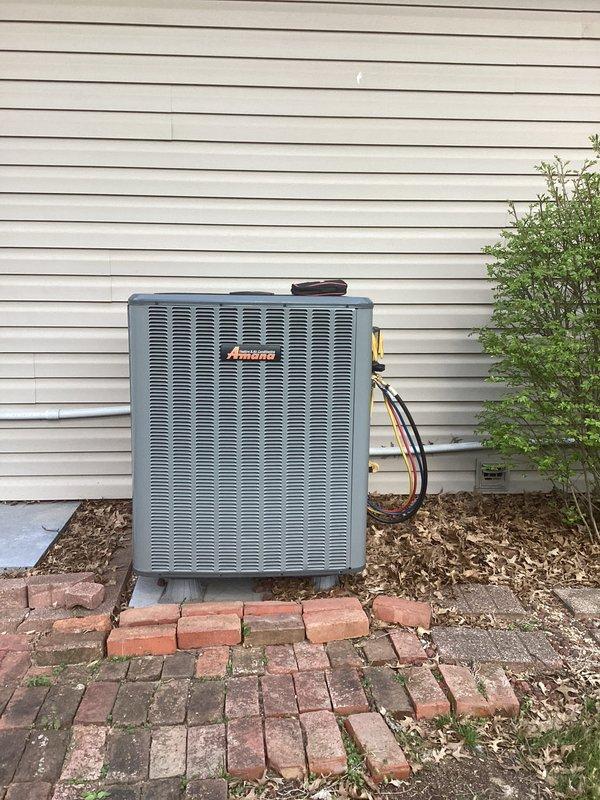 Completed comprehensive heating maintenance inspection on residential HVAC system consisting of indoor furnace unit and outdoor Amana heat pump. Identified expired 20x20x4 air filter requiring replacement, which was not included in basic maintenance service. Performed standard system checks, verified operational status of all components, and documented equipment condition with visual records of both interior furnace installation and exterior condenser unit.