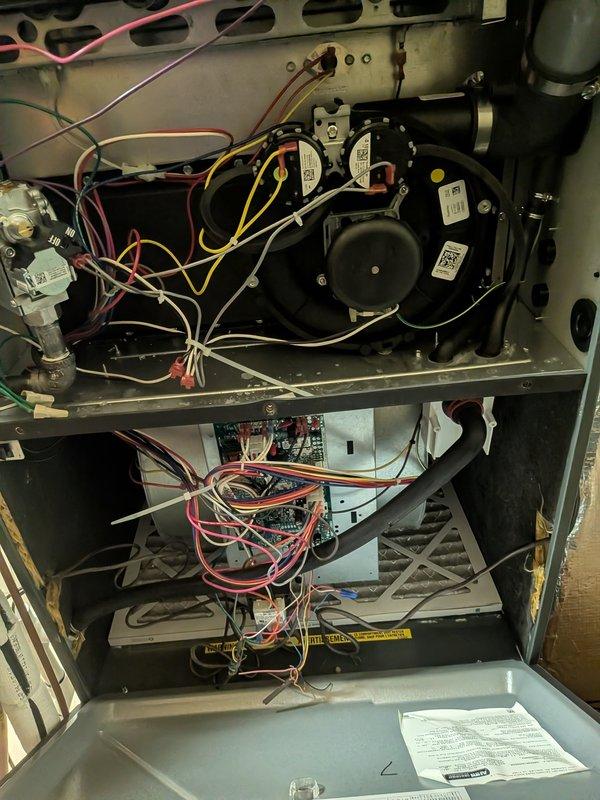 Performed heating maintenance on two HVAC units at the facility. Documented filter requirements for both systems: each unit contains two filter racks with the top rack requiring three 20x24x2 filters and the bottom rack requiring three 20x25x2 filters. Total filter specifications needed for ongoing maintenance are six 20x24x2 filters and six 20x25x2 filters. Inspected internal components including blower motor assembly, electrical connections, and control board. Photographed filter configuration and internal unit components for service records.