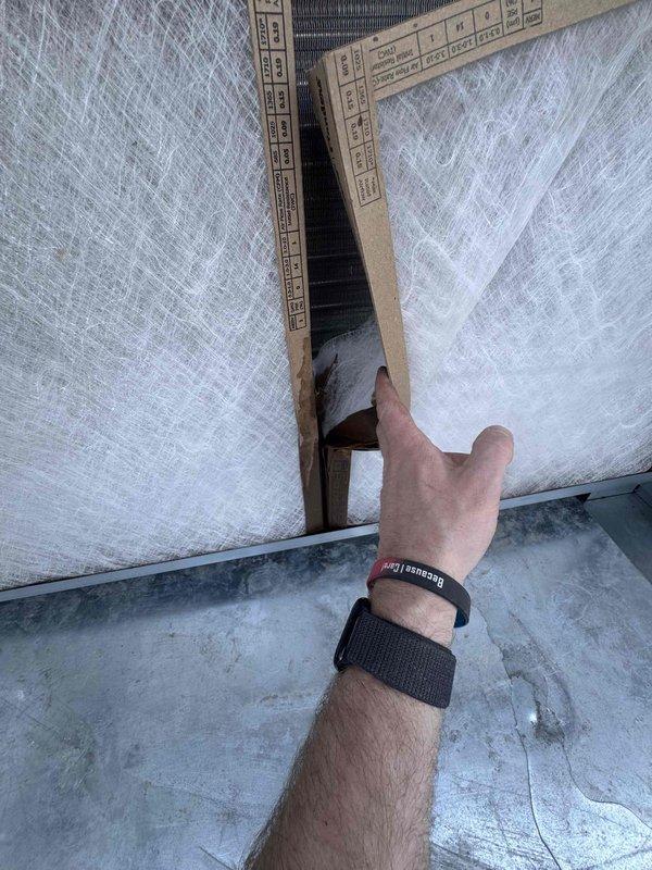 Responded to emergency call for complete loss of cooling and active water infiltration through ceiling tiles in multiple customer areas, including front counter and menu board locations. Investigated rooftop unit and identified compromised condensate drain system causing overflow and water penetration into occupied space near electrical components. Cleared drain line obstruction, verified proper drainage flow, inspected roof curb flashing and insulation integrity at unit penetration, and confirmed system returned to normal cooling operation with no further water leakage.