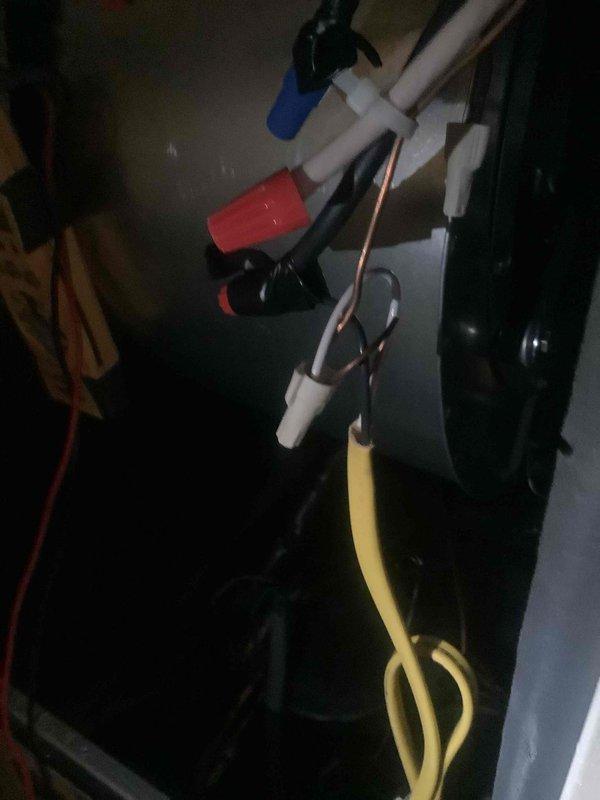 Completed HVAC system installation with all components properly positioned and connected in mechanical room. Installed air handler unit, condensate pump assembly, and associated refrigerant lines with proper insulation. Connected PVC condensate drain lines, copper refrigerant piping, and flexible gas line to manufacturer specifications, ensuring all connections are secure and system is ready for operation under warranty coverage.