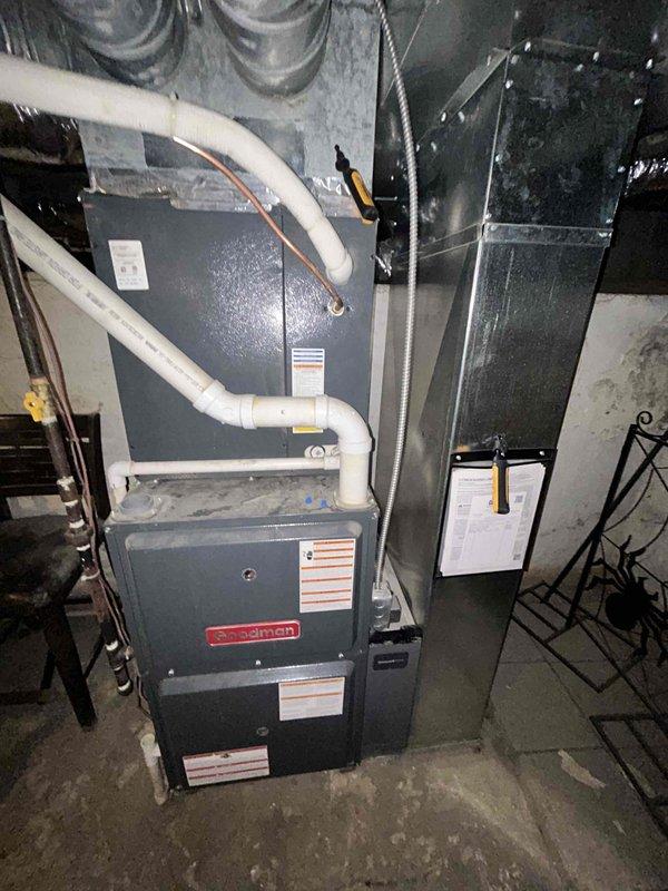 Responded to service call for air conditioning system blowing warm air. Upon arrival, performed diagnostic testing of electrical components using clamp meter to measure amperage and voltage at outdoor unit connections. Inspected indoor furnace and air handler assembly, checked refrigerant system operation, and verified proper electrical connections throughout the system to identify cause of cooling failure.