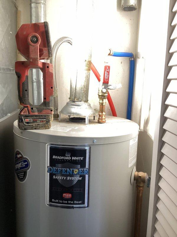 Completed monthly plumbing maintenance inspection as part of prepaid membership service. Inspected dual-head shower system with bronze finish fixtures and handheld wand in working condition, and examined Bradford White water heater with Defender Safety System including all supply lines, brass valve assemblies, and connection points. All plumbing components and fixtures found to be functioning properly with no leaks or deficiencies noted during inspection.