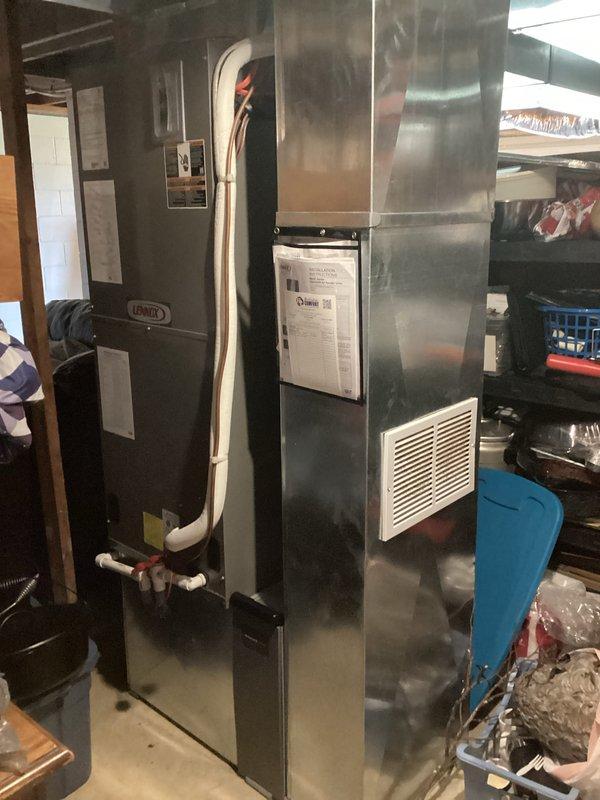 Completed monthly maintenance service on combined cooling and heating system. Performed comprehensive inspection of Lennox furnace unit and associated HVAC equipment located in basement mechanical room. Checked thermostat operation and confirmed Honeywell Home ProSeries digital unit displaying proper temperature readings at 72 degrees with system in off mode and fan set to auto. Verified WiFi connectivity functioning correctly. Inspected furnace components, ductwork connections, and PVC condensate drainage. Documented equipment condition through photographic records. Customer requires 20x20x4 filter which was not included in this service visit.