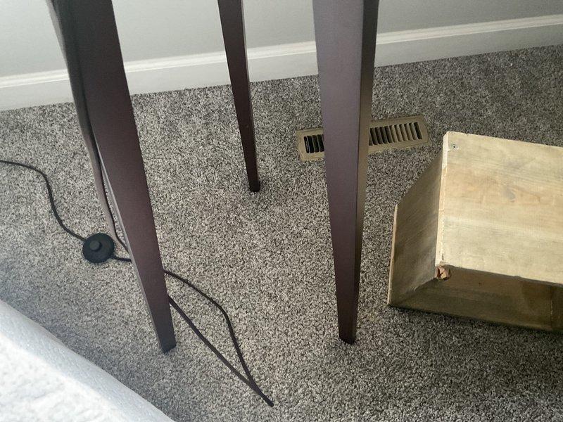 Completed estimate for residential duct cleaning system. Inspected multiple supply and return vents throughout the home, including floor registers in carpeted areas and ceiling-mounted vents in hallway. Assessed condition of ductwork and noted accumulation of dust and debris within visible vent openings. Investigated dryer vent routing concern and attempted to trace exhaust path to determine if termination point is properly vented to exterior or potentially misdirected beneath structure. Documented current HVAC system layout and vent locations with photographs for estimate preparation.