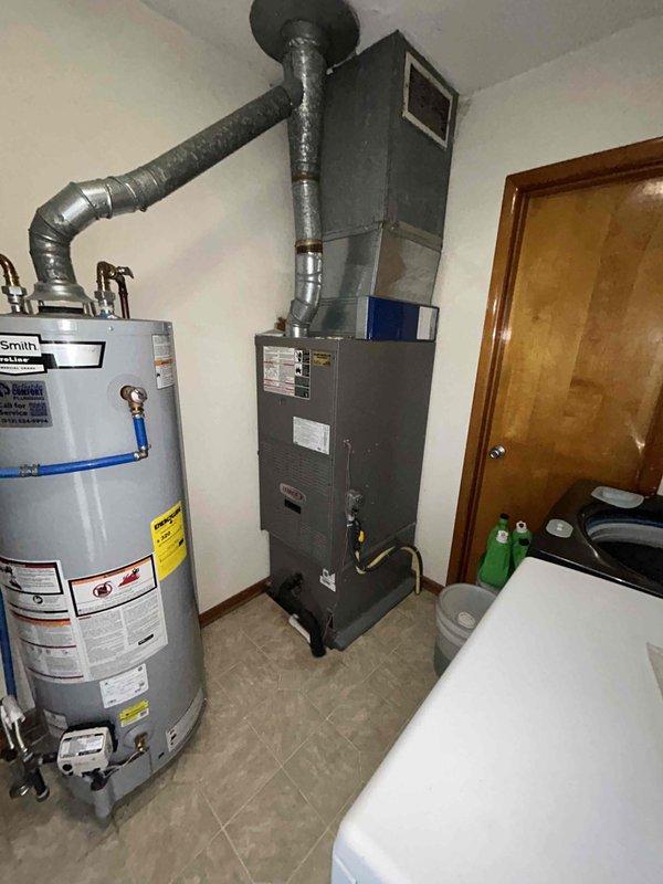 Responded to no-cooling complaint on residential air conditioning system. Performed diagnostic evaluation of outdoor condensing unit and indoor air handler to assess system condition and determine repair versus replacement options. Documented equipment configuration including refrigerant line connections, electrical service, and indoor furnace/air handler setup for customer consultation regarding available repair solutions.