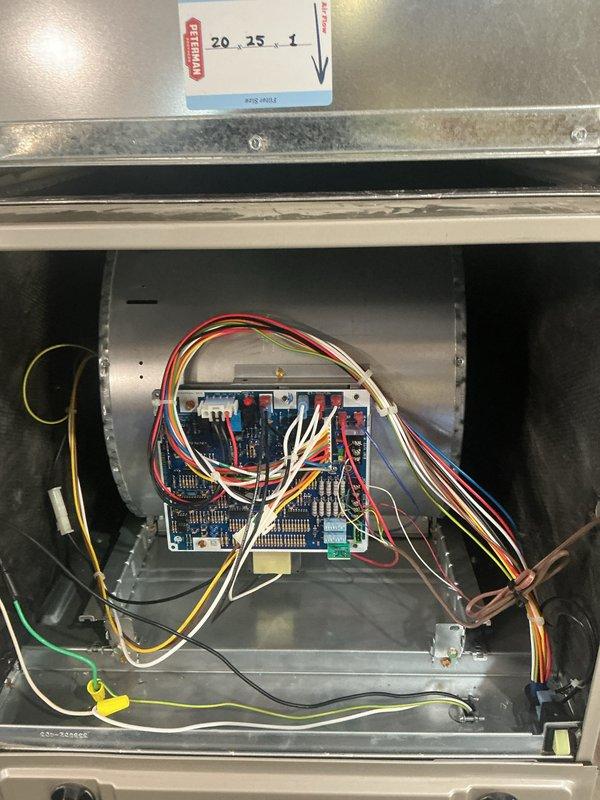 Completed complimentary cooling system inspection and preventive maintenance as part of basic monthly service agreement. Performed visual inspection of outdoor condensing unit and indoor air handler components, including control board, electrical connections, and refrigerant line sets. Documented equipment condition with photographs showing electronic control board with multiple relay connections, terminal blocks, and properly routed wiring harnesses within the air handler cabinet. Outdoor unit inspection revealed weathered electrical connections at contactor housing with visible corrosion on metal components and aged wire insulation, consistent with normal outdoor exposure. Noted copper refrigerant lines with insulation showing typical wear patterns. Filter status could not be determined during this visit. System operational at time of inspection with all electrical components and connections functioning as designed.