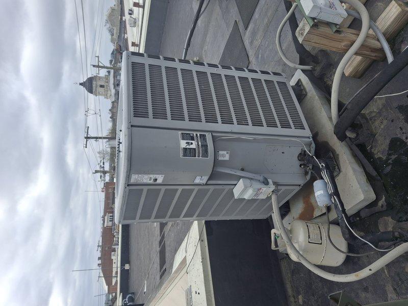 Returned to commercial rooftop location to pressurize the air conditioning system and perform leak detection procedures. Successfully pressurized the system and conducted thorough inspection of the rooftop HVAC unit, associated refrigerant lines, and condensate piping to identify source of refrigerant loss.