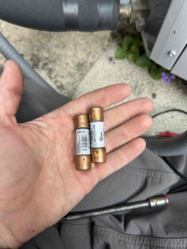 Responded to no cooling complaint on residential air conditioning system. Upon inspection, discovered two blown fuses in the outdoor condenser unit's electrical circuit. Replaced failed fuses, restoring power to the unit and returning system to normal cooling operation.
