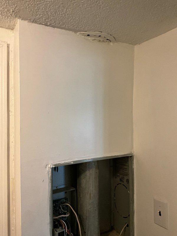 Conducted site assessment for commercial HVAC unit replacement due to outdated equipment presenting safety hazards. Documented existing system configuration including electrical connections, wall-mounted components, and exterior installation location with foundation-level placement. Provided competitive estimate for new unit installation as alternative to previously obtained quote.