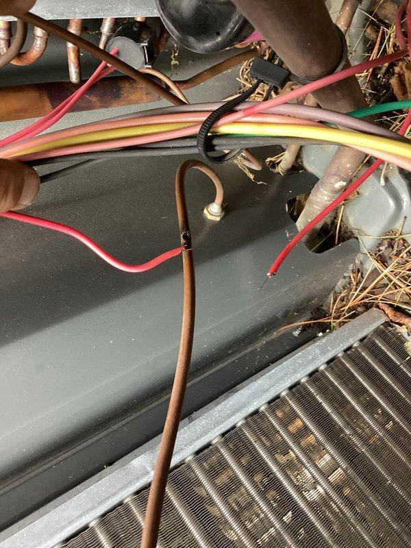 Performed HVAC system repair addressing defrost board and airflow issues. Upon inspection, discovered significant accumulation of pine needles and organic debris within the unit's interior, concentrated around the evaporator coil and internal components. Removed all debris from the system to restore proper airflow and prevent potential operational interference. Inspected and tested defrost board functionality, electrical connections, and associated wiring harness. Verified evaporator coil condition and copper refrigerant line connections for proper operation. System tested and confirmed operational following debris removal and component evaluation.