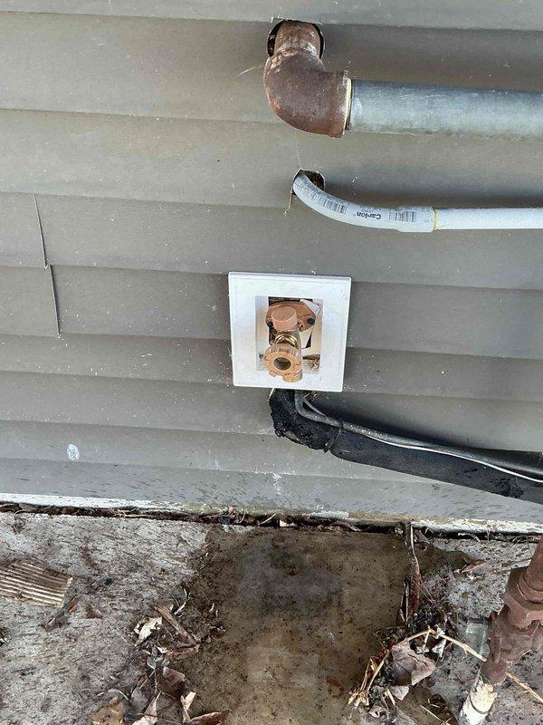 Responded to service call for busted water line supplying exterior hose bibs on slab foundation home. Located failed section of copper water line, performed necessary repairs to restore water service to outside faucets, and installed access panel for future maintenance. Verified system integrity and proper water flow upon completion.