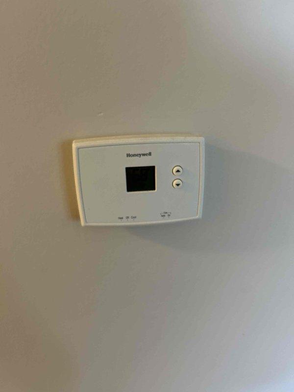 Completed comprehensive heating and cooling system tune-up and preventative maintenance inspection. Verified operation of Honeywell thermostat controls and confirmed proper communication between thermostat and HVAC equipment. Inspected mechanical room equipment including AO Smith water heater, electrical connections, and associated plumbing infrastructure to ensure all systems operating within normal parameters.