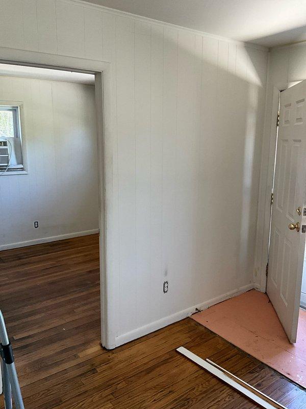 Conducted on-site evaluation for heat pump system installation at residential property currently equipped with electric baseboard heating. Assessed interior spaces, existing electrical infrastructure, and structural considerations for transitioning from baseboard heat to a heat pump HVAC system. Documented current heating configuration and identified suitable locations for indoor air handler placement and outdoor condensing unit installation to provide both heating and cooling capabilities.