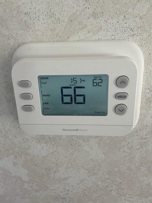 # HVAC Maintenance Report

Completed annual heating maintenance service on an Abren furnace system as part of recurring preventive maintenance program. Performed comprehensive inspection of heating equipment, including visual assessment of unit condition, cabinet integrity, and safety label verification. Evaluated Honeywell Home digital thermostat operation, confirming proper display function and temperature control response. System currently set to cooling mode at time of inspection with setpoint at 62°F and ambient temperature reading 66°F. Verified thermostat communication and control functionality including mode selection, fan control, and hold features. Inspected furnace installation documentation and manufacturer specifications posted on unit. Confirmed all warning labels and safety placards remain visible and legible on equipment cabinet. Documented equipment condition through photographic records. Unit located in confined utility space with adequate access for service. Filter s