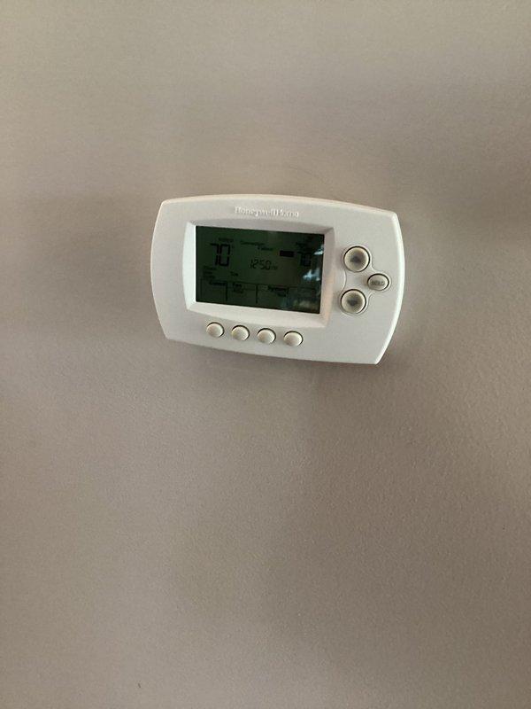 Responded to service call to verify refrigerant charge levels on residential air conditioning system. Connected Fieldpiece SMAN digital manifold gauges to measure system pressures and confirmed R-410A refrigerant operating at 13.9 psig suction pressure and 137.9 psig discharge pressure with saturation temperature of 45.4°F. System refrigerant charge verified to be within manufacturer specifications with no adjustments required.