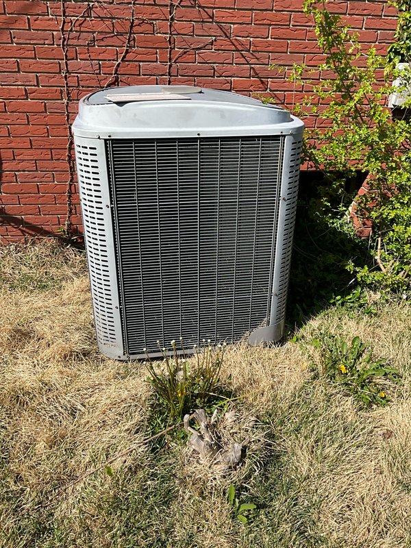 Conducted comfort consultation for full HVAC system replacement estimate. Inspection revealed both outdoor condenser coil and indoor evaporator coil actively leaking refrigerant due to system age. Documented existing equipment configuration including basement-mounted furnace with metal supply ductwork and outdoor condensing unit positioned against exterior brick wall. Provided comprehensive replacement options for complete system upgrade with priority timeline for immediate installation.