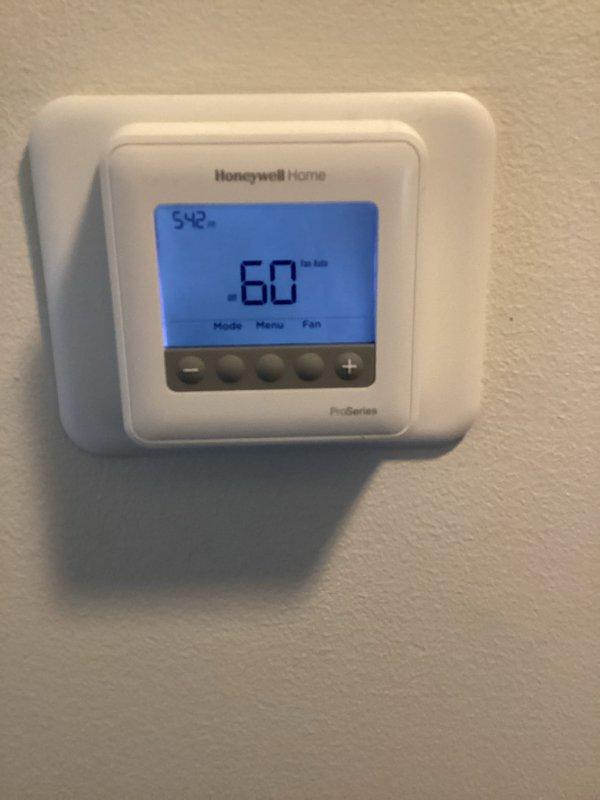 Responded to no heating/cooling complaint with reported plastic smell following previous service visit. Upon arrival, inspected Honeywell ProSeries programmable thermostat and traced wiring to HVAC system components. Examined transformer and associated low-voltage wiring connections between ductwork, verifying proper wire terminations and checking for signs of overheating or damaged insulation that could produce odor. System was found in off position at time of inspection, requiring further diagnostic work scheduled for follow-up appointment to identify root cause of complete system failure and odor concern.