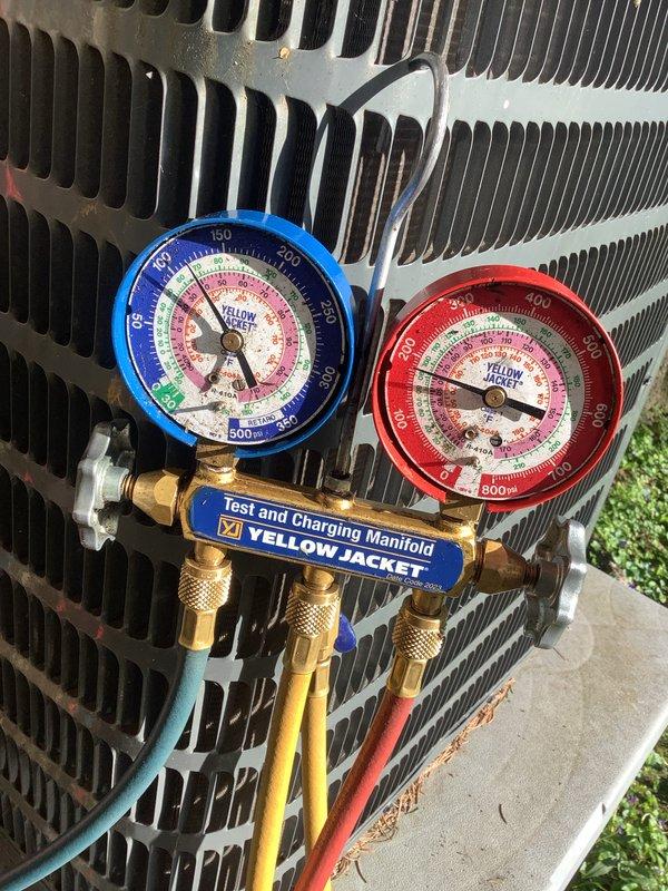 Completed monthly maintenance service on two HVAC cooling systems at duplex property. Performed comprehensive system inspections including refrigerant pressure testing using manifold gauge set on outdoor condenser units, verified proper operating pressures and system performance. Replaced two 16x25x1 air filters, confirmed thermostat operation displaying 73°F, and inspected condenser coil fins for proper airflow.