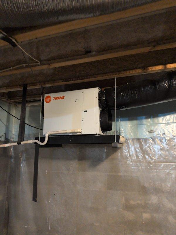Completed comprehensive cooling check on two HVAC systems. Inspected Trane air handler unit located in crawl space, verified proper operation of all components, checked refrigerant levels, and tested system controls. Verified thermostat functionality showing system in heating mode with proper temperature display and zone control operation. Both systems operating within normal parameters. Unable to determine filter size during this visit; recommend obtaining proper measurements for future filter replacements. Service contract renewed through 7/31/26.