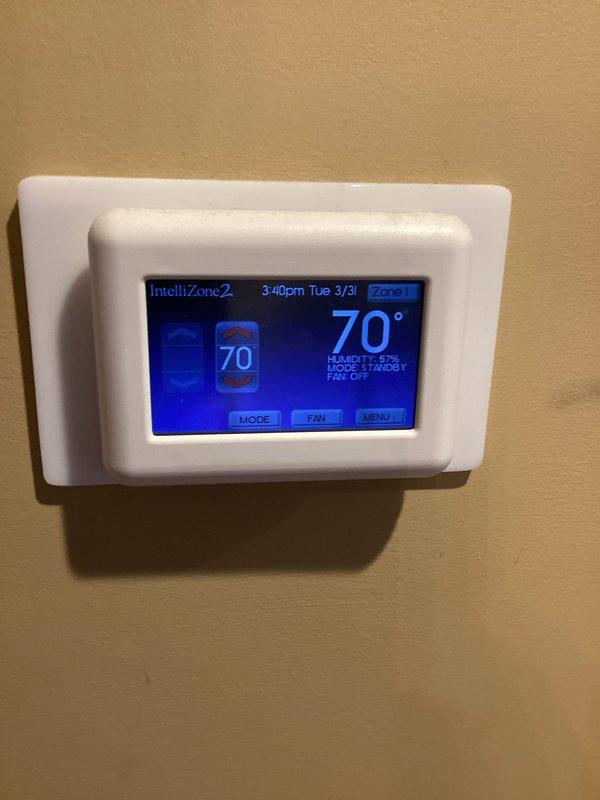 Completed routine HVAC maintenance on two-system residential installation with active membership service. Replaced 16x20x4 air filter as part of monthly maintenance program and verified system operation through IntelliZone2 thermostat control, confirming proper zone functionality and standby mode settings at 70°F with 57% humidity reading.