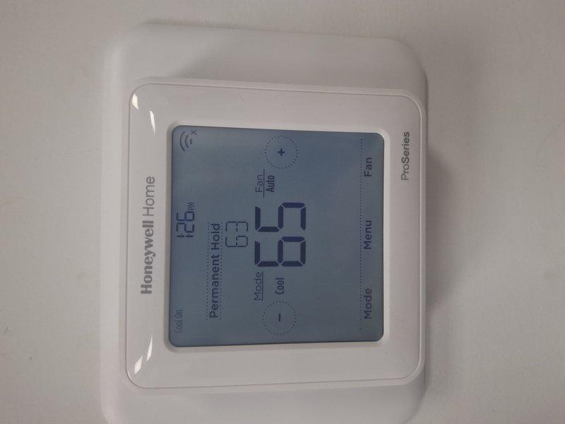 Returned to address previous frozen system condition. Upon arrival, verified thermostat operation and confirmed unit is now cycling properly in cooling mode with temperature reading 48°F and system responding to setpoint adjustments. System operating normally with no freeze-up present at time of inspection.
