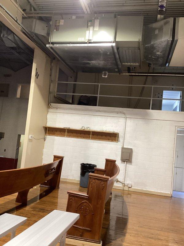 Responded to no cooling call on central air conditioning system approximately 10-15 years old. Upon arrival, located air handling unit mounted at ceiling level in multi-level commercial space. Performed diagnostic evaluation of system components and verified electrical disconnect switch position on concrete block wall near equipment panel. Inspected circuit breaker panel and electrical connections serving HVAC system. Documented equipment conditions and electrical infrastructure with photos for service records. System evaluated and findings reviewed with occupant.