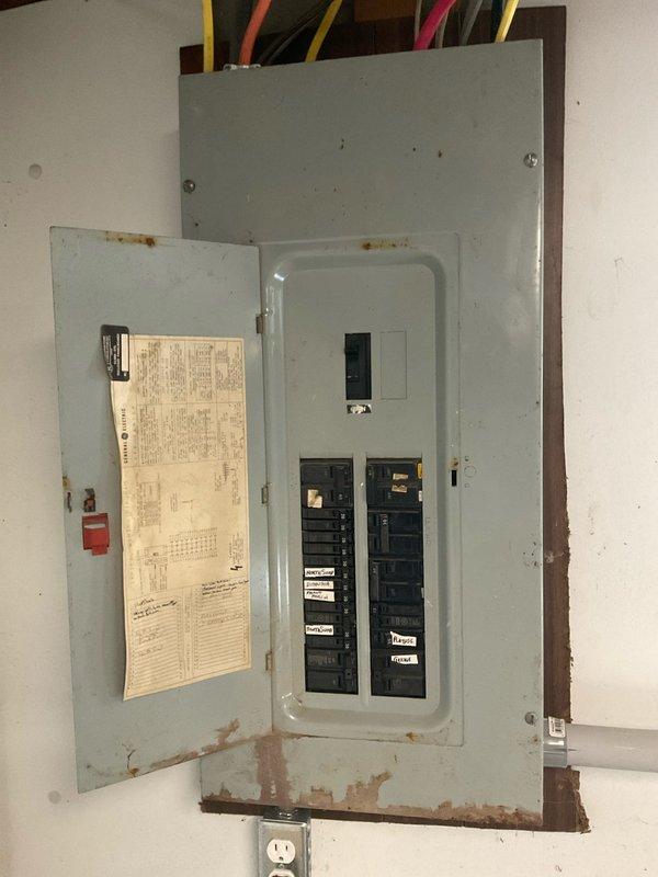 Conducted on-site evaluation for ductless mini-split system installation at residential property. Assessed existing electrical infrastructure, including General Electric loadcenter panel with visible age-related corrosion at lower enclosure and mounting points. Documented electrical panel capacity and breaker configuration to determine compatibility with proposed mini-split system requirements and provided estimate for complete installation.