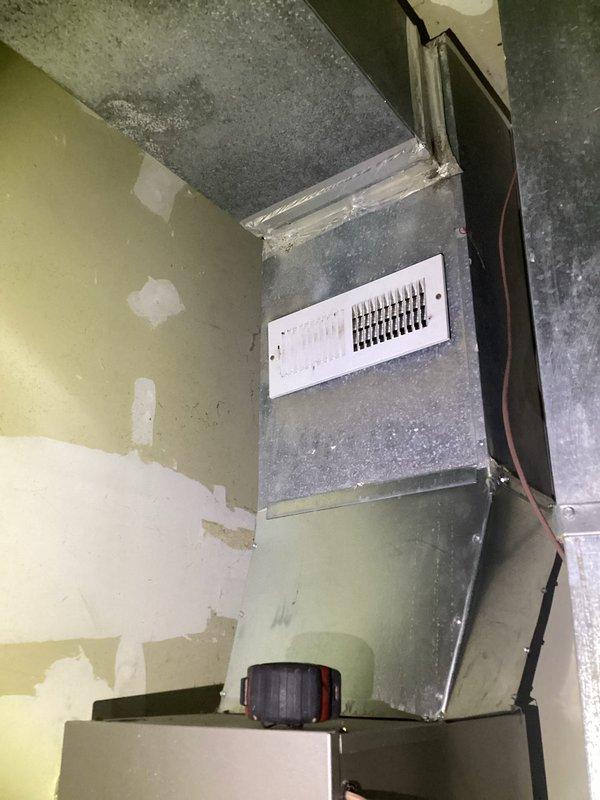 Responded to follow-up service call for recurring ductwork leak issue previously identified during routine maintenance. Conducted thorough inspection of attic-installed supply plenum and duct transitions, documenting current conditions with photos showing aged metal ductwork with visible surface deterioration and compromised sealing at connection points. Assessed wall-mounted vent register installation in mechanical space where water intrusion damage was evident from peeling paint and wall surface deterioration around ductwork penetrations, indicating ongoing condensation or leak concerns requiring remediation.