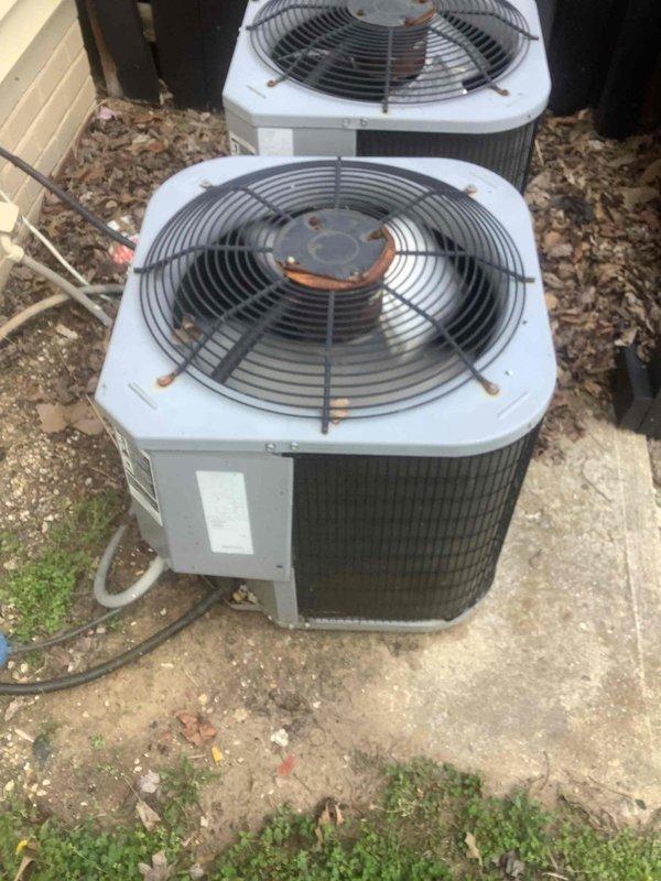 Responded to diagnostic service call for HVAC system malfunction. Performed comprehensive system diagnostics using multimeter for electrical testing and Yellow Jacket manifold gauge set to check refrigerant pressures on dual outdoor condenser units. Units showed visible signs of age with weathering, oxidation, and rust-colored staining on components and fan grilles. Evaluated electrical components, refrigerant levels, and overall system operation to identify root cause of reported issue.