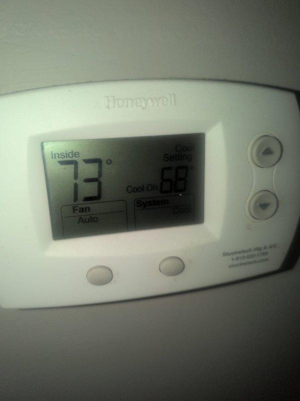 Completed CCC Basic Monthly maintenance service on residential cooling system. Performed standard inspection protocol, verified thermostat operation showing 73°F with system running in cooling mode and fan set to auto, confirmed proper temperature control functionality. Replaced 16x20x1 air filter at air handler unit, documented filter change with technician initials and service date on filter rack label per maintenance tracking procedures.