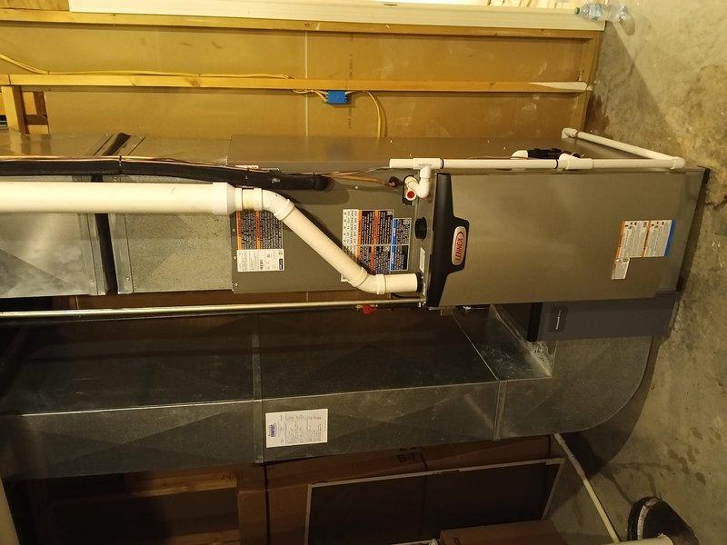 Completed full HVAC system installation at residential property. Installed new horizontal air handler unit in basement utility area with proper mounting and leveling on concrete floor. Connected all necessary PVC condensate drain lines to unit for moisture removal. Installed metal supply plenum beneath air handler to distribute conditioned air throughout home. Verified all ductwork connections were secure and properly sealed. Ensured all manufacturer specifications were met during installation process. System tested and confirmed operational upon completion.