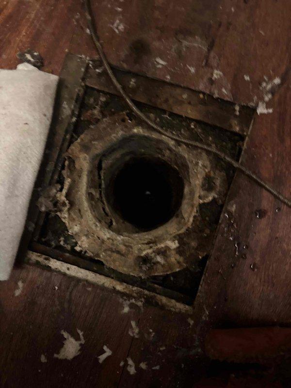 Responded to sewer line blockage affecting kitchen and powder room drainage in property with 25-year-old clay tile sewer system. Performed video camera inspection through interior floor access point and exterior cleanout to assess line condition. Camera inspection revealed significant root intrusion and confirmed deteriorated clay tile piping throughout the main sewer line, causing the obstruction and reduced flow capacity.