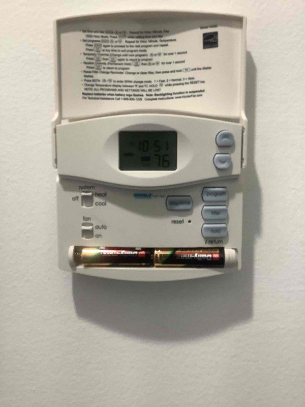 Completed scheduled HVAC cooling system maintenance tune-up at residential property. Performed comprehensive system inspection and preventative maintenance procedures on air conditioning equipment. Verified thermostat operation and functionality, including programmable settings, temperature accuracy, and mode selections for heat/cool/off and fan auto/on controls. Confirmed proper battery backup with AAA batteries installed and operational. System tested and operating within normal parameters at time of service completion.