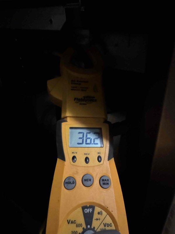 Replaced defective electric heat kit under warranty. Verified proper amperage draw of 38.6 amps on heat strips using clamp meter, confirming system is operating within manufacturer specifications and heating elements are functioning correctly.