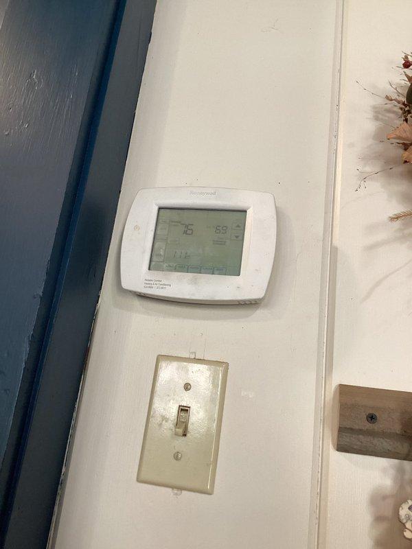 Responded to no cooling complaint on geothermal system with high pressure alarm indicated by flashing red light. Upon arrival, found thermostat calling for cooling with significant temperature differential between set point and actual room temperature. Diagnosed high pressure safety lockout condition on geothermal heat pump unit. Measured supply air temperature at register reading 50°F, confirming system was producing cool air at time of inspection. Reset high pressure alarm and verified system operation. System returned to normal cooling mode with proper airflow and temperature output.