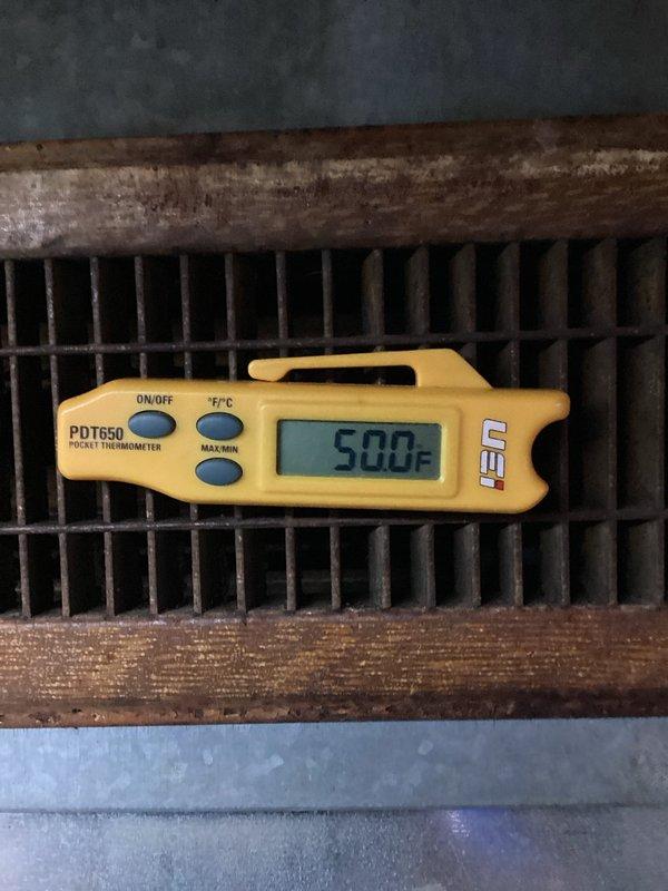 Responded to no cooling complaint on geothermal system with high pressure alarm indicated by flashing red light. Upon arrival, found thermostat calling for cooling with significant temperature differential between set point and actual room temperature. Diagnosed high pressure safety lockout condition on geothermal heat pump unit. Measured supply air temperature at register reading 50°F, confirming system was producing cool air at time of inspection. Reset high pressure alarm and verified system operation. System returned to normal cooling mode with proper airflow and temperature output.