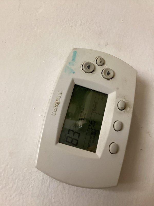 Responded to no cooling complaint on residential air conditioning system. Upon arrival, found Honeywell thermostat set to system off position with display showing 78°F and 2:08 PM. Diagnosed faulty thermostat preventing system operation. Removed existing Honeywell unit and installed new Tru-Temp programmable thermostat. Verified proper wiring connections and configured new thermostat settings. System now operational with accurate temperature control restored.