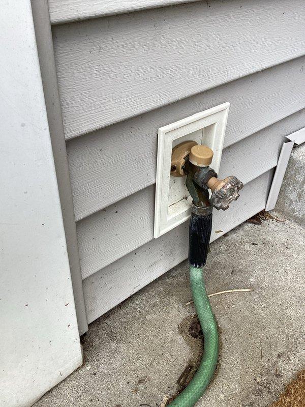 Completed monthly plumbing inspection as part of prepaid maintenance membership. Inspected exterior hose bib and connection point on home's exterior siding, confirming proper operation and no visible leaks at fixture or attachment point. Evaluated interior bathroom faucet operation and water flow, noting minor mineral deposits and hard water buildup on chrome fixture surfaces that do not currently affect functionality.